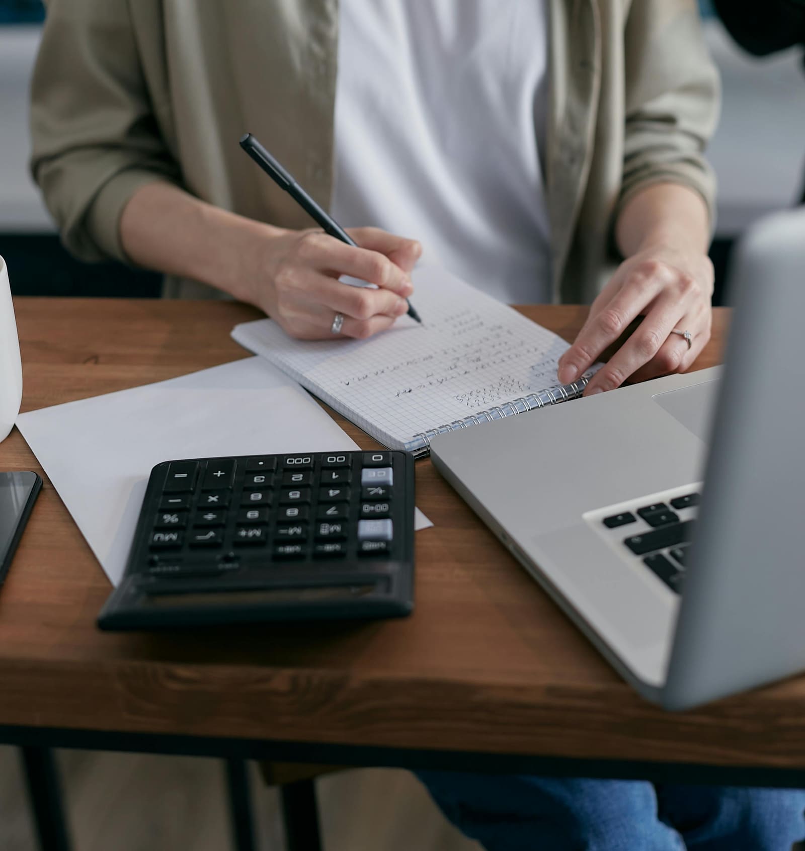 Working through figures with a calculator and notebook